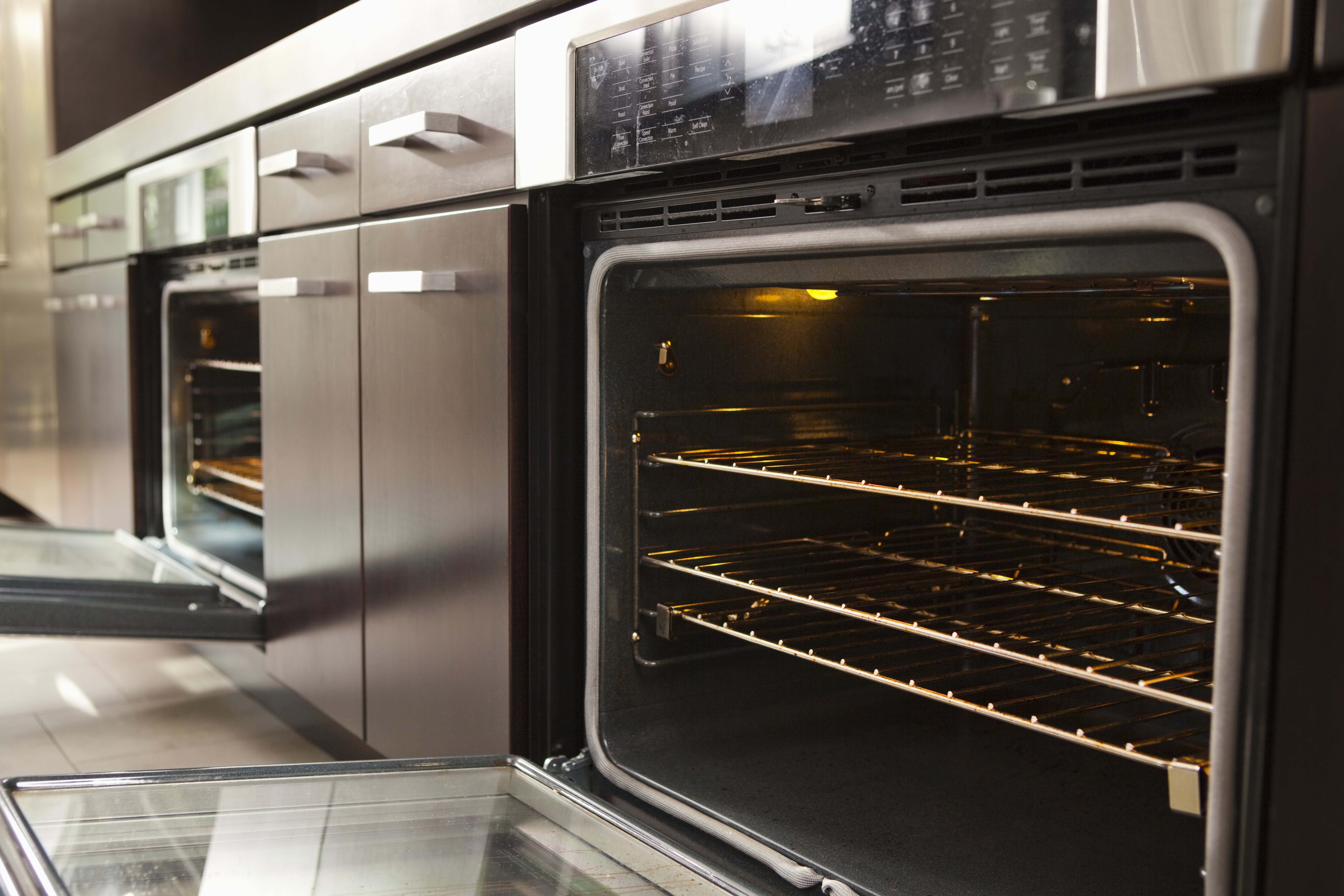 an open oven in the modern kitchen