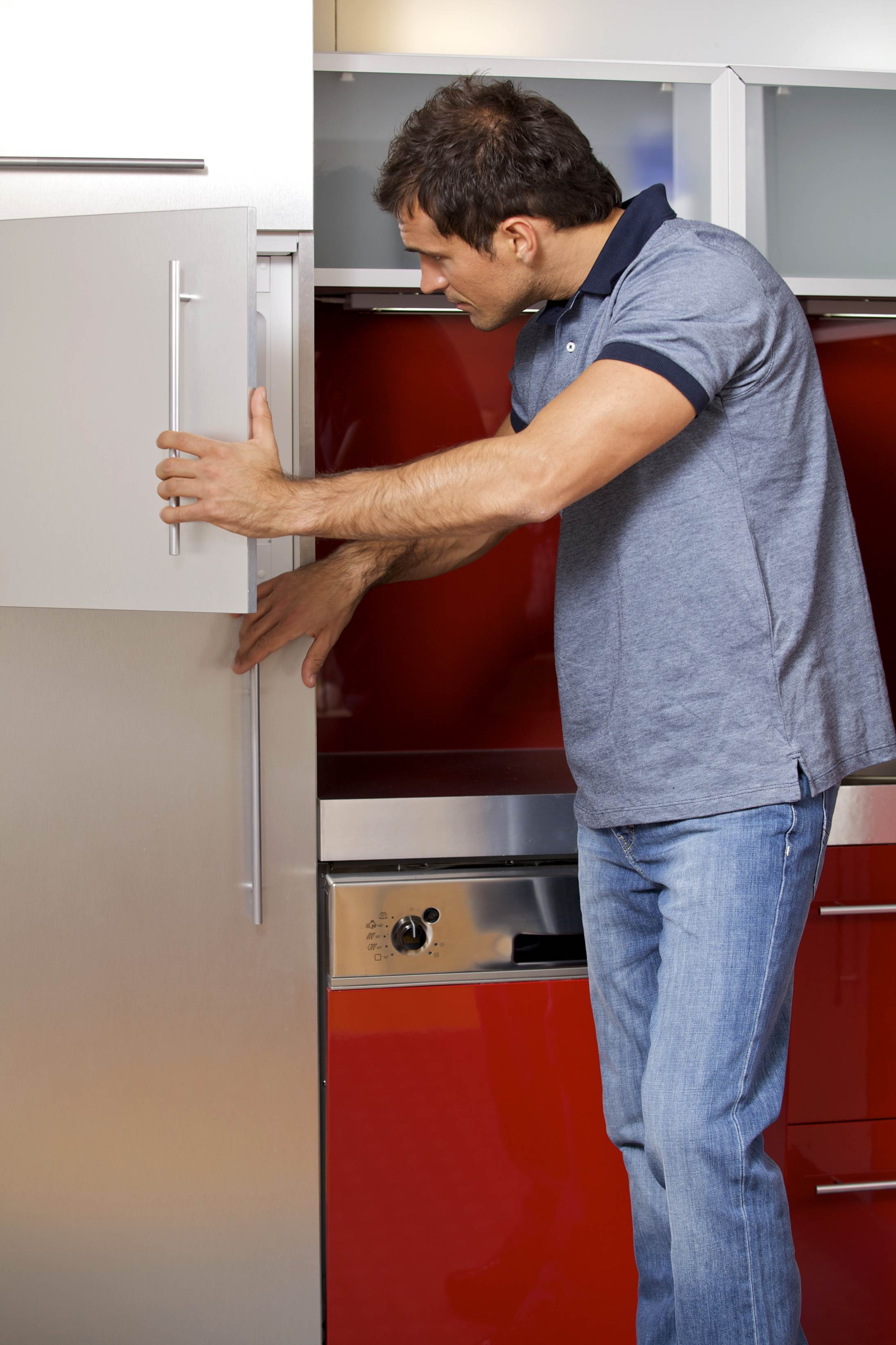 man looking inside the refrigerator