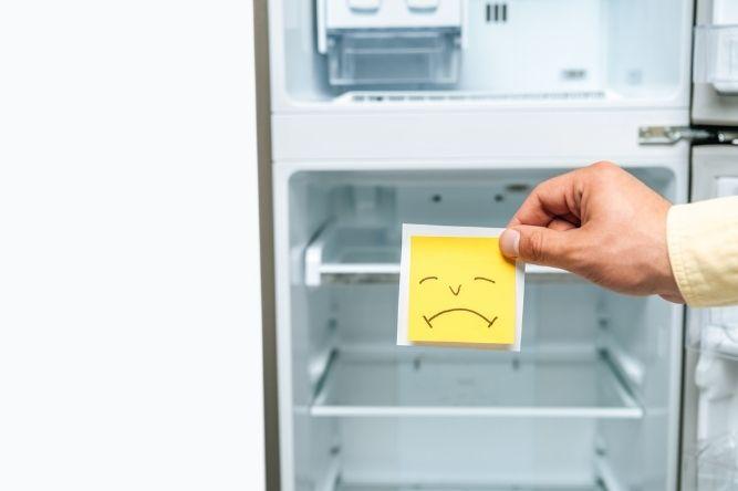 sad emoji sticker in front of the fridge