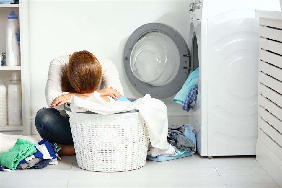 woman crying over laundry